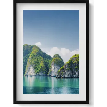 Obraz Elegantní obraz do obýváku v černém rámu Tyrkysové moře a útesy 50x70 cm