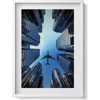 Obraz Dekorativní nástěnný obraz s rámem a grafikou loft Letadlo nad budovami 50x70 cm