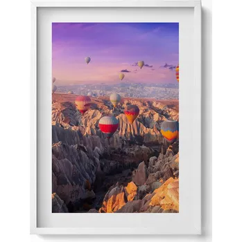 Obraz Dekorativní obraz v bílém rámu do obýváku Balóny letící nad kaňonem 50x70 cm