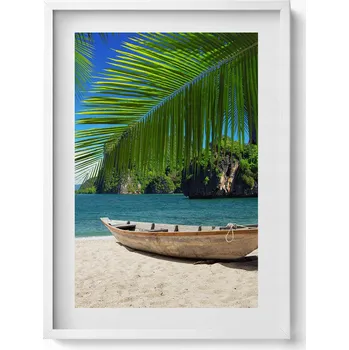 Obraz Elegantní obraz do obýváku v bílém rámu Loďka na pláži pod palmou 50x70 cm