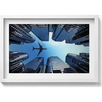 Obraz Dekorativní nástěnný obraz s rámem a grafikou loft Letadlo nad budovami 60x40 cm