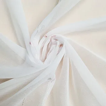 GERSTER Vyšívaná luxusní záclona GERSTER 11545 bílá - lososová 290 cm