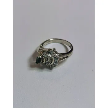 Prsten Stříbrný prsten s broušeným vltavínem a bílými zirkony