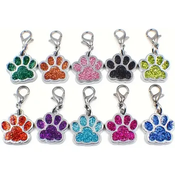 Přívěsek Přívěsek na klíče/obojek Tlapka třpytivá (Přívěsek s karabinkou vhodný i na obojek pro psy, posázené kamínky. Testováno na nikl. Materiál: Zinkoslitina.)