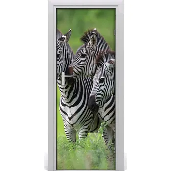 Fototapeta Samolepící fototapeta na dveře Tři zebry 75x205 cm