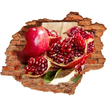 Fototapeta Nálepka 3D díra na zeď Granátové jablko s listmi