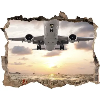 Fototapeta Foto fotografie díra na zeď Letadlo nad mořem