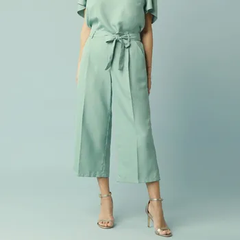 Dámské kalhoty Široké 7/8 kalhoty s pružným pasem a páskem, pro menší postavu zelená 48