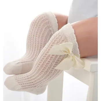 Dívčí pletené ponožky s mašlemi žlutá 0-2 roky