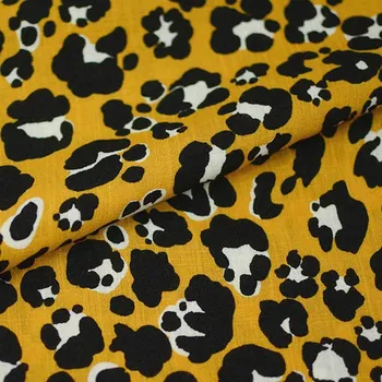 Šatovka 19616 žlutá, černý zvířecí vzor, š.140