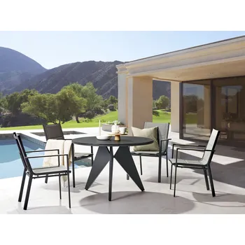 Jídelní stůl Venkovní jídelní set Černý hliník 4místný kulatý stůl 110 cm čalouněné židle s šedými polštáři Beliani