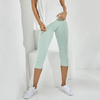 Dámské kalhoty 3/4 jednobarevné kalhoty světle zelená 42/44