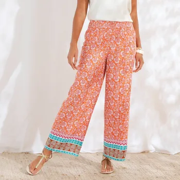 Dámské kalhoty Široké kalhoty s potiskem a vysokým žabičkovaným pasem oranžová 38/40