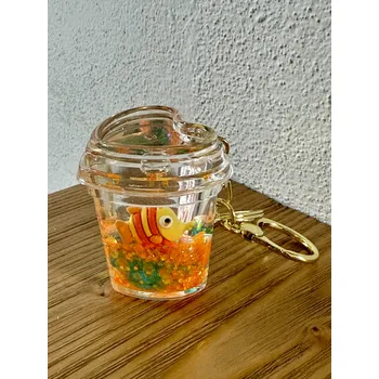 Klíčenka v tekutině s rybkou v srdci