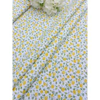 Látka 100% bavlna - žluté růžičky na bílé