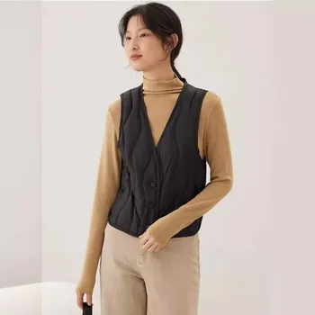 Dámská vesta Dámská zateplená vesta – prošívaná, na knoflíky, hluboký výstřih Barva: Černá, Velikost: XL