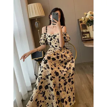 Dámské šaty letní šaty s květinovým vzorem – elegantní áčkový střih bez rukávů Barva: Aprikotová, Velikost: S