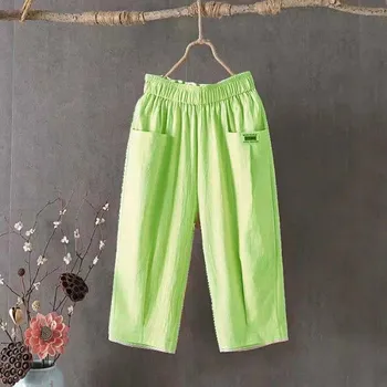 Dámské kalhoty Dámské volné kalhoty z lnu – letní capri s pružným pasem Barva: Zelená, Velikost: L