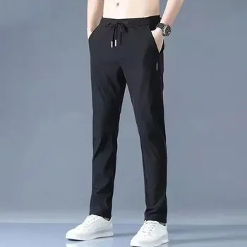 Pánské kalhoty Pánské kalhoty s rovným střihem z lehkého rychleschnoucího materiálu Velikost: M, Barva (Varianta): K34 Black