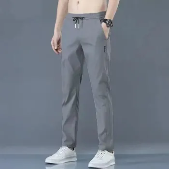 Pánské kalhoty Pánské kalhoty s rovným střihem z lehkého rychleschnoucího materiálu Velikost: 5XL, Barva (Varianta): K34 Tmavě šedá