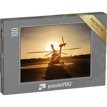 Puzzle puzzle 100 dílků „Vrtulník na přistávací ploše při západu slunce“