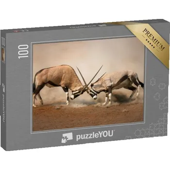 Puzzle puzzle 100 dílků „Souboj dvou samců gemsboka“