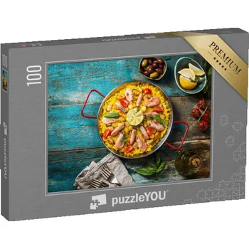 Puzzle puzzle 100 dílků „Paella s mořskými plody, pánev na starém dřevěném stole“