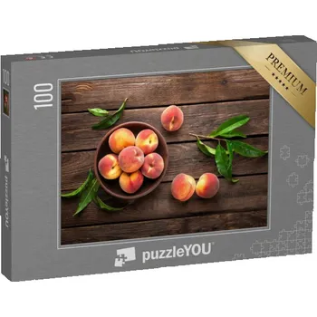 Puzzle puzzle 100 dílků „Čerstvé šťavnaté broskve s listy“