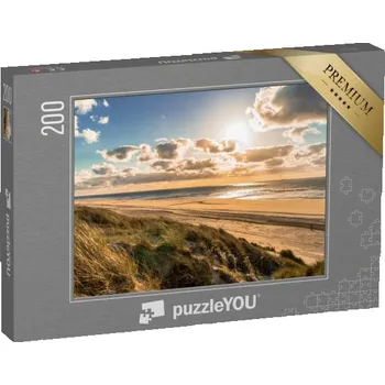 Puzzle puzzle 200 dílků „Divoké pobřeží Severního moře s dramatickou oblohou, Holandsko“