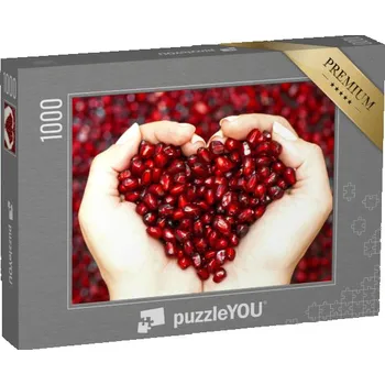 Puzzle puzzle „Semínka granátového jablka v rukou, které tvoří srdce“