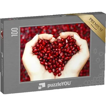 Puzzle puzzle 100 dílků „Semínka granátového jablka v rukou, které tvoří srdce“