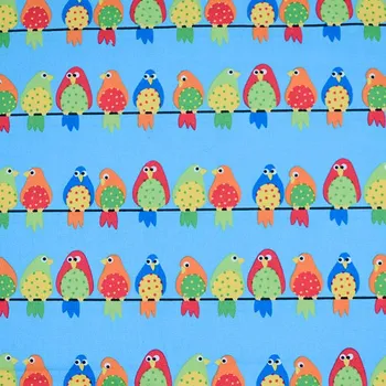 Bavlněné plátno modré s papoušky, š. 150