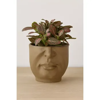 Stojan na květiny Bloomingville Hilig – obal na květináč z kameniny s reliéfem obličeje, Ø 10,5 cm