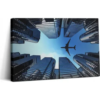 Obraz Fotoobraz na plátně do kanceláře k zavěšení - Letadlo nad budovami