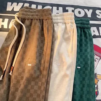 Volné unisex tepláky s kostkovaným vzorem Velikost: 2XL, Barva (Varianta): Khaki CP642