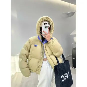 Dámská parka Krátká dámská zimní bunda s kapucí a volným střihem Barva: Zelená, Velikost: S