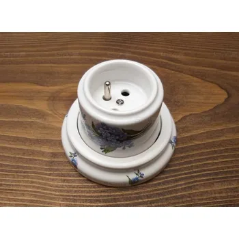 vypínač Keramická zás. bílá vysoká s rámečkem a dekorací