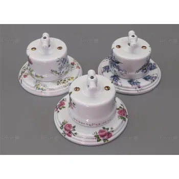 Elektrická zásuvka Porcelánový vypínač Garby s podložkou dekorovaný