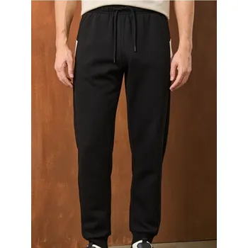 Pánské kalhoty Sinsay - Teplákové kalhoty se širokými nohavicemi - černá - 001EV-99X - 001EV-99X-S