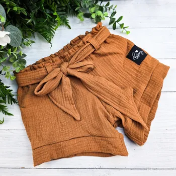 Dívčí kraťasy Kulišárny Dívčí šortky s mašlí mušelín BRONZ VELIKOST: 116