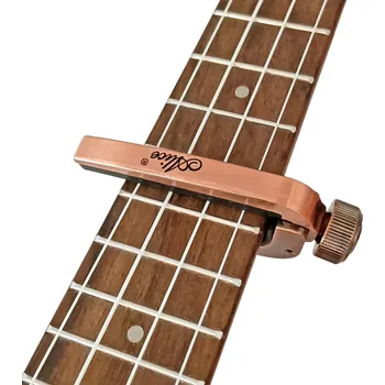 Klasická kytara Capo na kytaru Univerzální kapodastr pro akustickou a elektrickou kytaru Pružinový mechanismus Rychlé přichycení Hudební příslušenství měděná