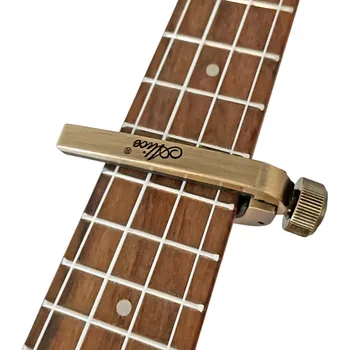 Hudebniny Capo na kytaru Univerzální kapodastr pro akustickou a elektrickou kytaru Pružinový mechanismus Rychlé přichycení Hudební příslušenství zlatá
