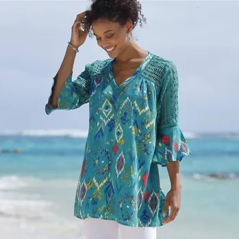 Rozšířená tunika s macramé a potiskem smaragdová 36