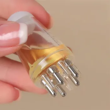 Masážní aplikátor oleje do vlasů