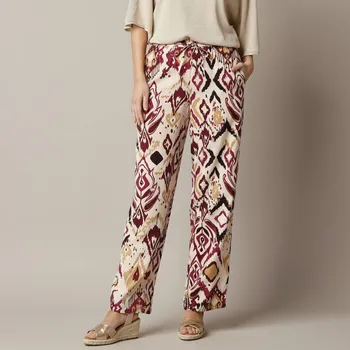 Dámské kalhoty Vzdušné široké kalhoty s potiskem béžová 52