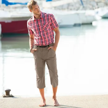 Plátěné 3/4 kalhoty s kapsami a pružným pasem tmavě béžová 48/50