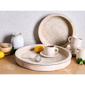 Sada 2 servírovacích podnosů světle hnědá mangové dřevo kulatý tvar tácek moderní boho styl doplňky Beliani