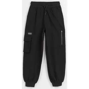 Reporter Young | Dívčí černé oversize tepláky s našitými kapsami na nohavicích - Barva ČERNÁ, Velikost 152 243-0117G-12-100-1