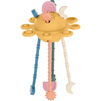 PETITEMARS PETITE&MARS Hračka silikonová senzorická Crazy planet Intense Ochre 10m+