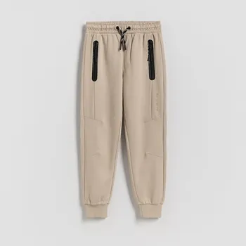 Chlapecké kalhoty Reserved - Bavlněné jogger kalhoty - béžová - 139FI-08X - 139FI-08X-116